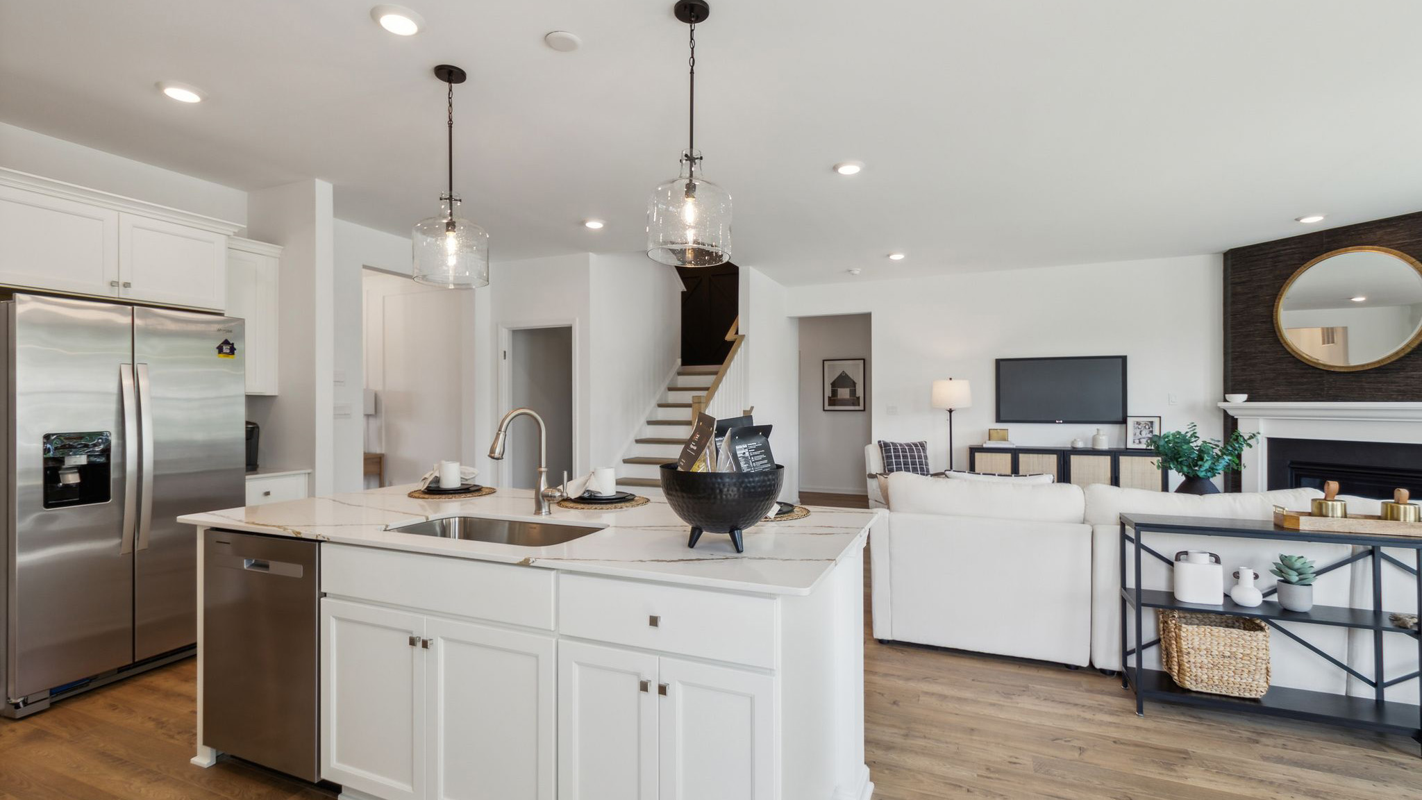 Kitchen flows seamlessly into the living area.
