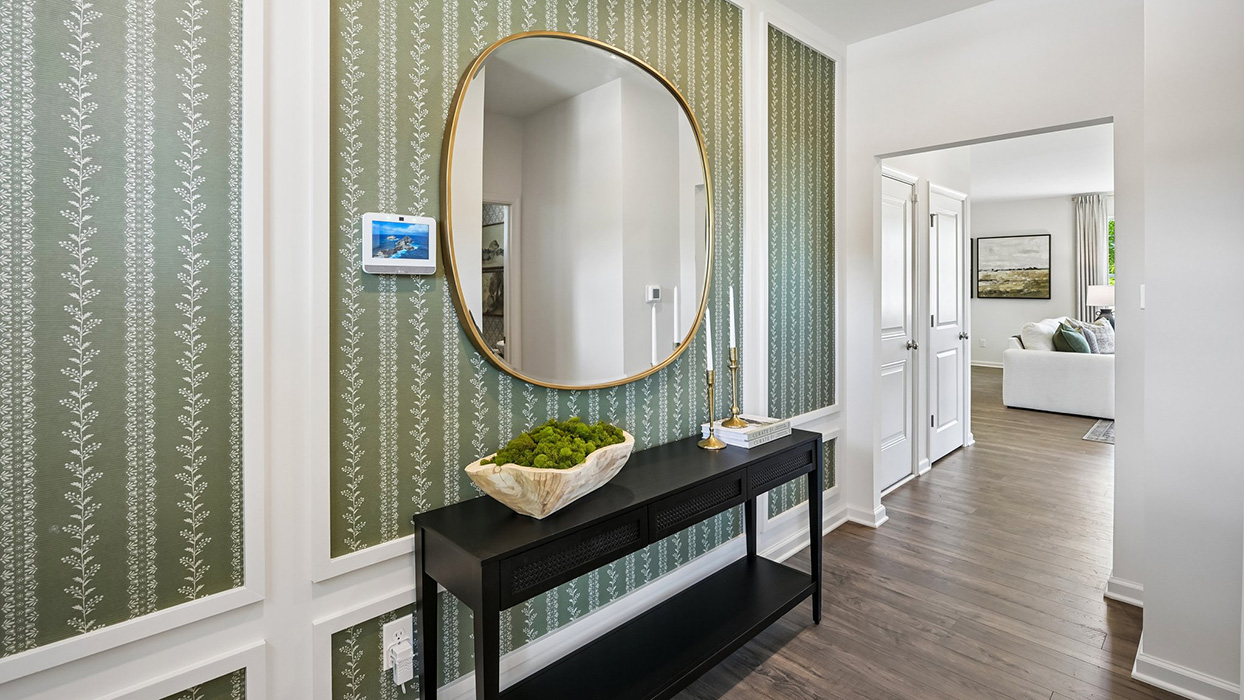Hallway leads to open-concept living space.