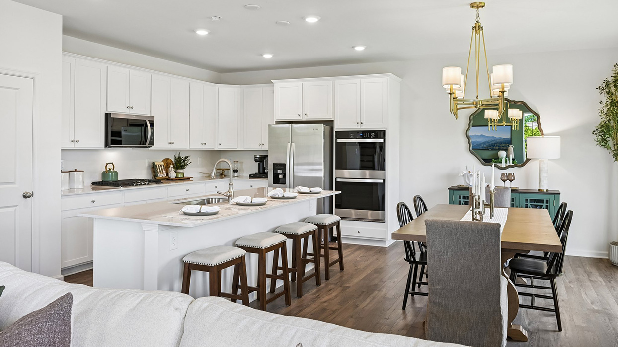 Open-concept allows a view encompassing dining, kitchen, and living areas.