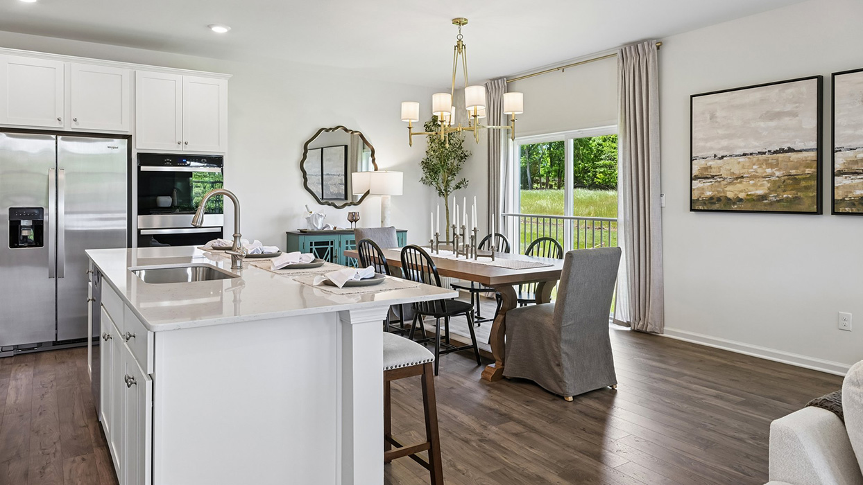 Enjoy seamless hosting capabilities with large kitchen island, large dining space, and access to backdoor.