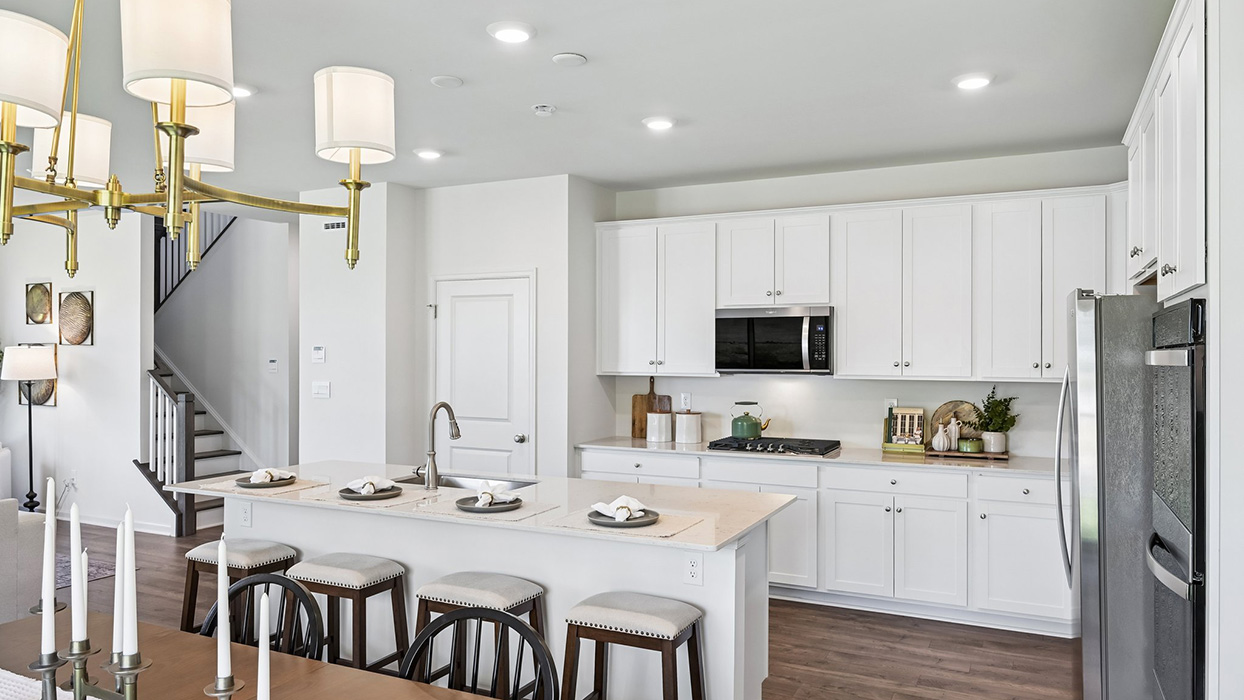 Expansive kitchen island allows guests to have barstool seating.