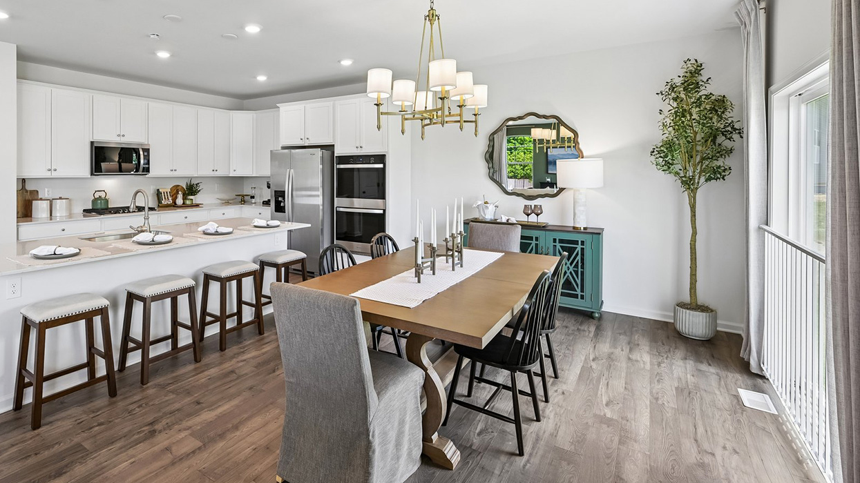 Enjoy seamless hosting capabilities with large kitchen island, large dining space, and access to backdoor.