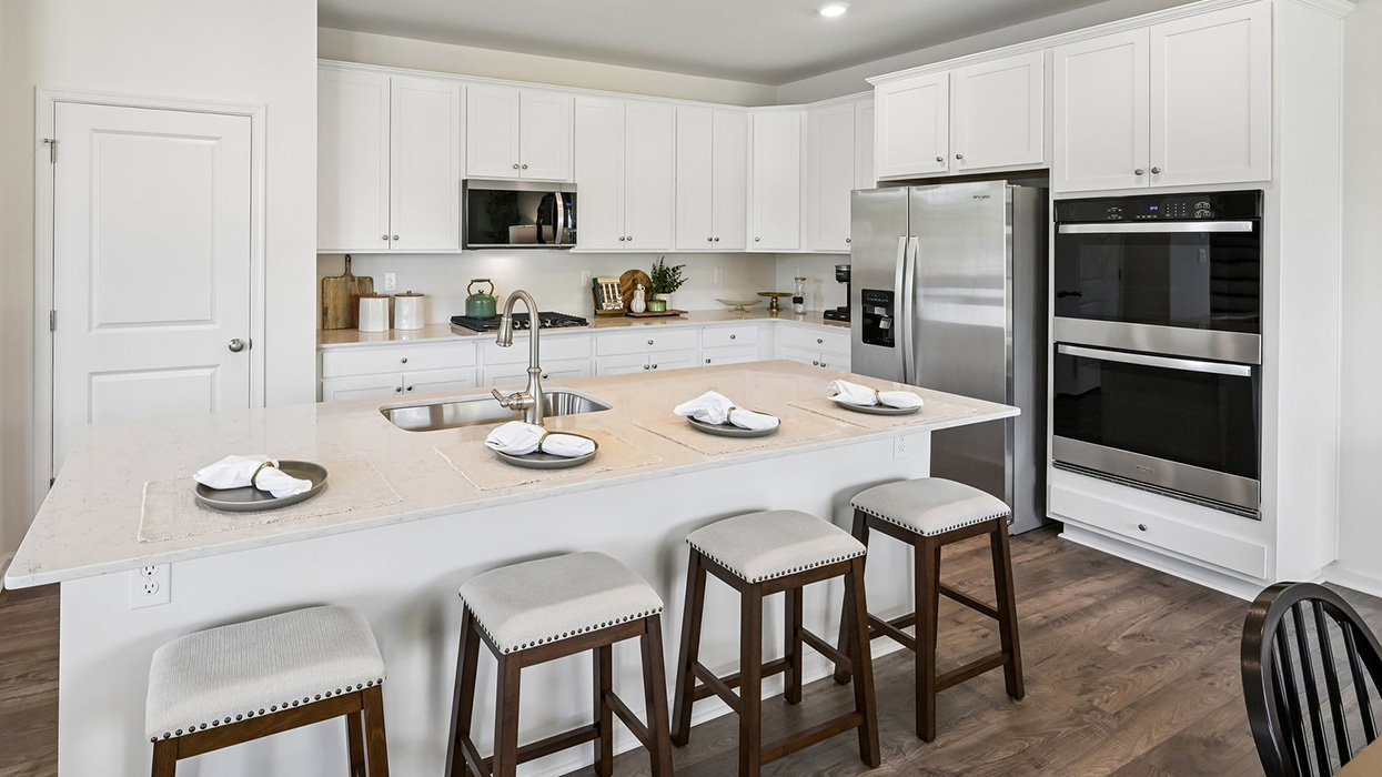 Expansive kitchen island allows guests to have barstool seating.
