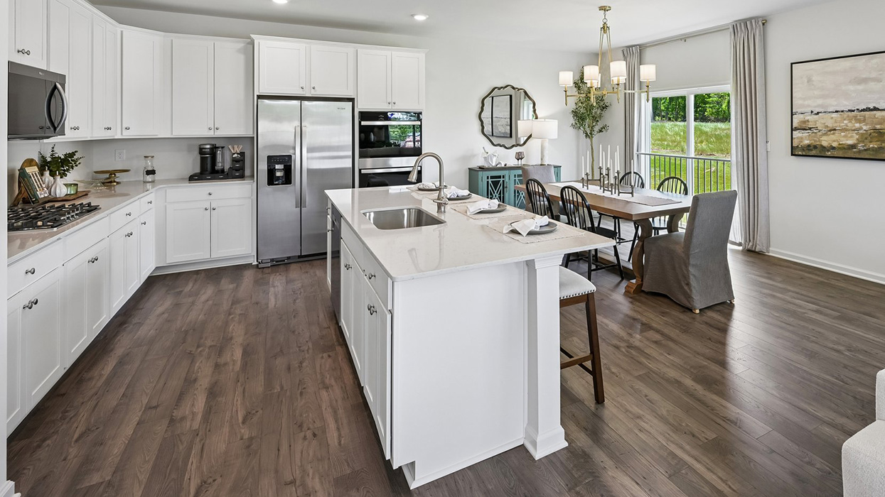 Enjoy seamless hosting capabilities with large kitchen island, large dining space, and access to backdoor.