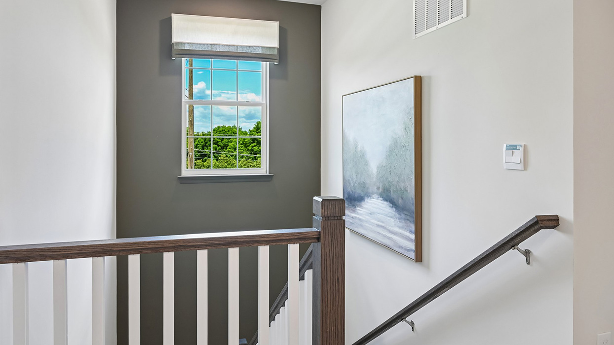 Staircase with landing lead to second floor.