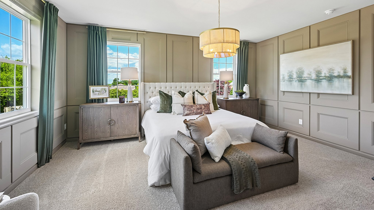 Master bedroom features multiple windows and sprawling floor space.