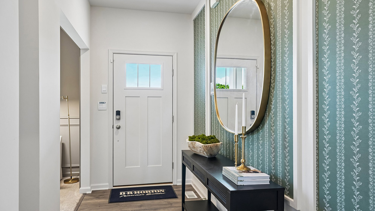 Front door opens up to main hallway and flex space.