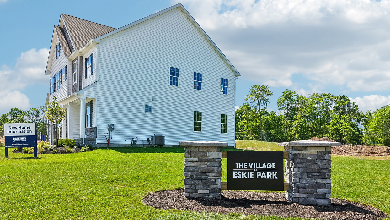Photograph of tasteful community sign with view of the Sorrento's expansive depth.