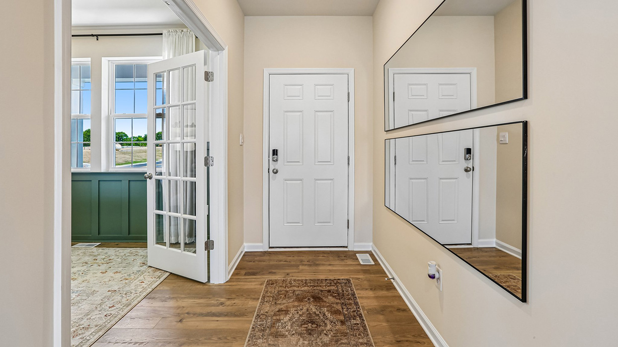 This well-designed home has an inviting foyer that is open to the functional flex room.