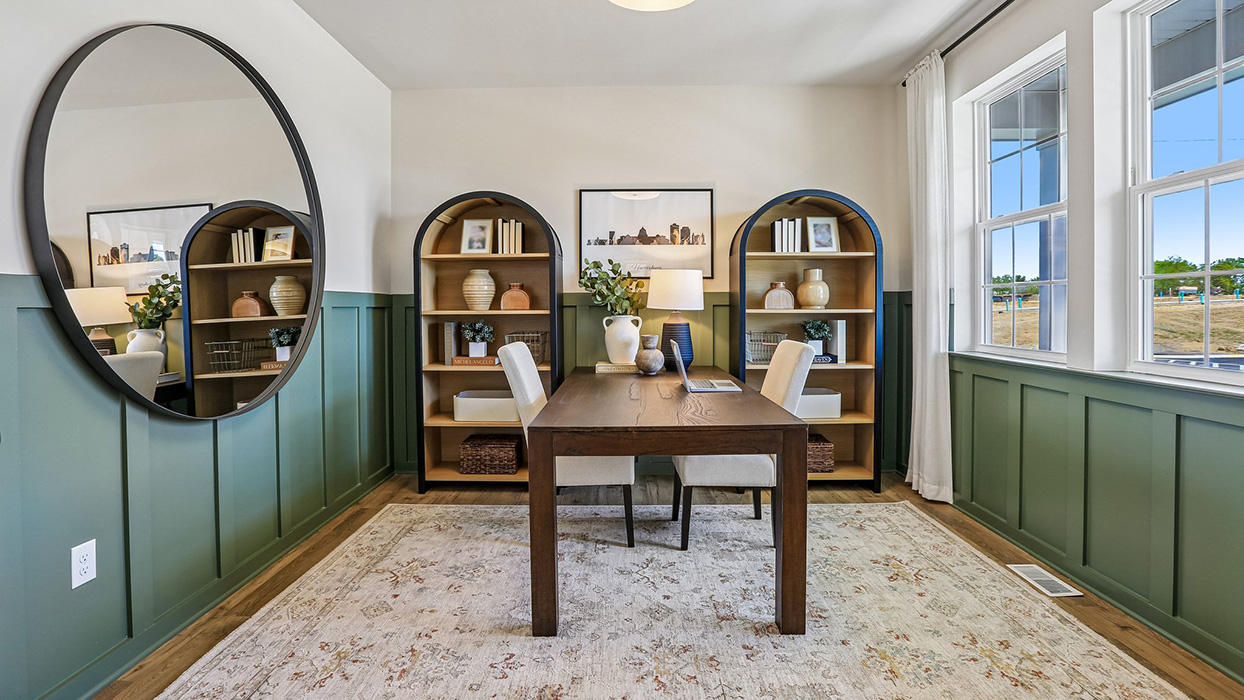 The flex room features high ceilings and two windows.