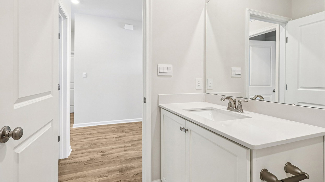 Bathroom two with single vanity and white vanity and bathtub