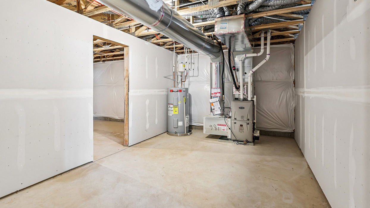 The unfinished basement with HVAC utilities