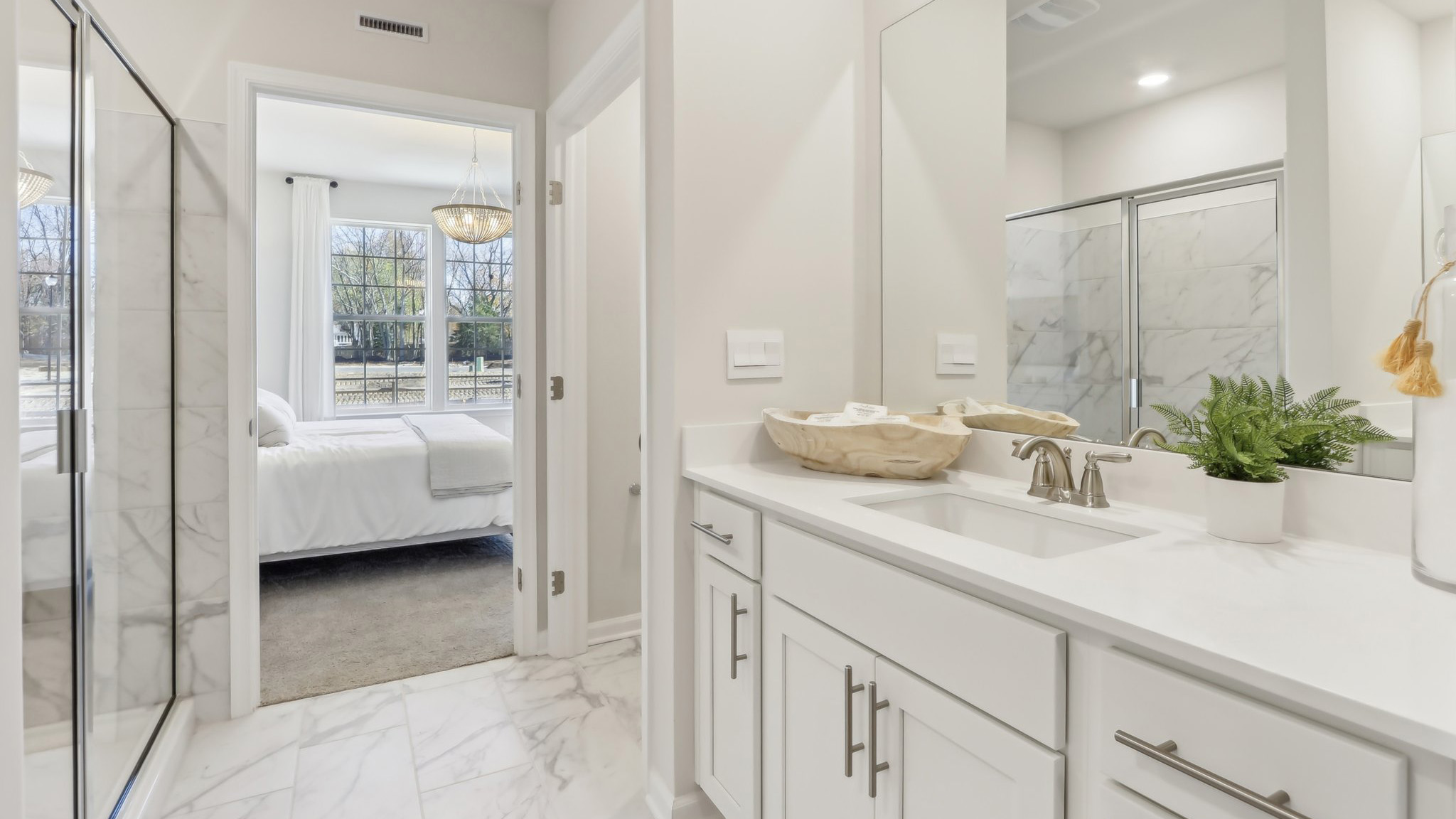 on suite bathroom with glass shower door