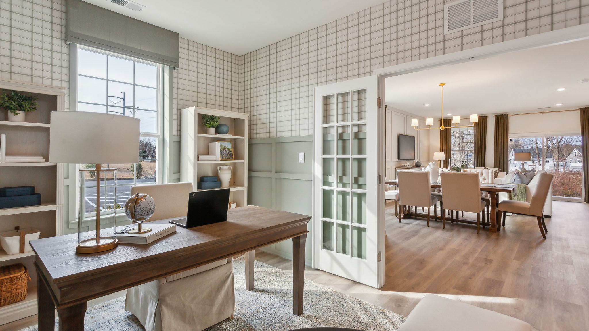 A den is located outside the front entryway and can be closed off with french doors.