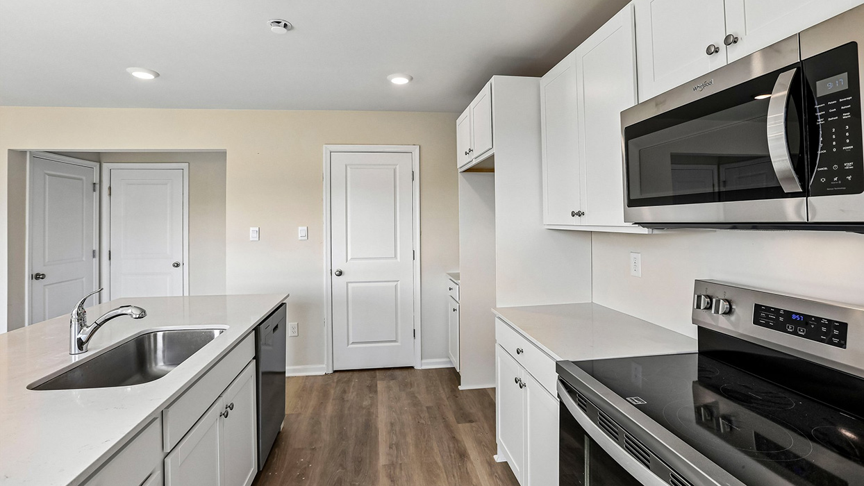 kitchen with white cabinets and stainless steel appliances
