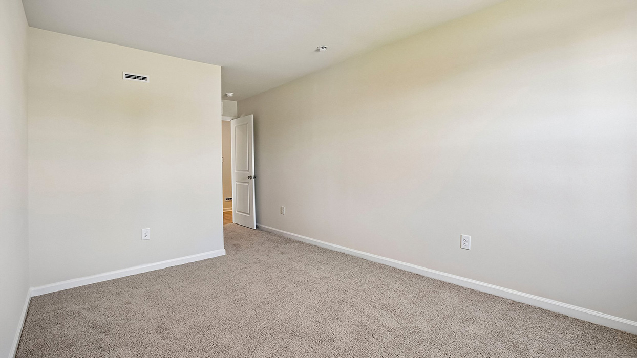 bedroom three with a closet