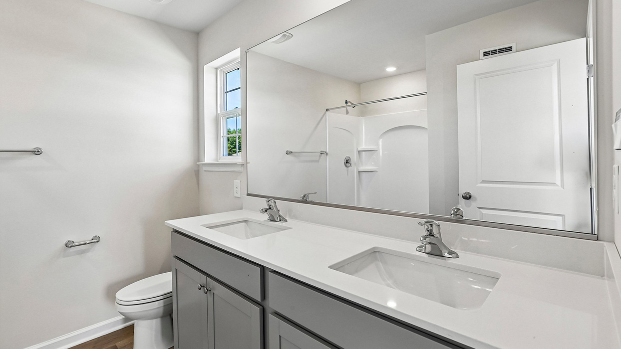 master bathroom with gray cabinets