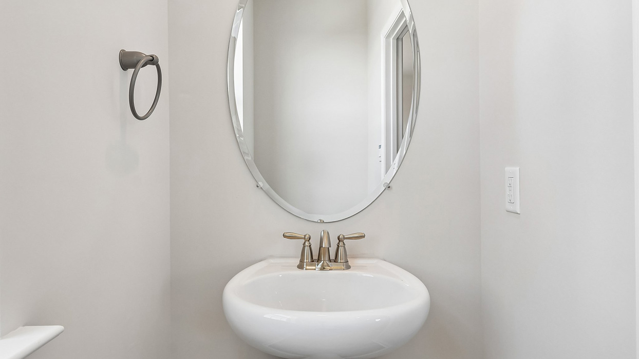 The powder room is located off the Living room area.