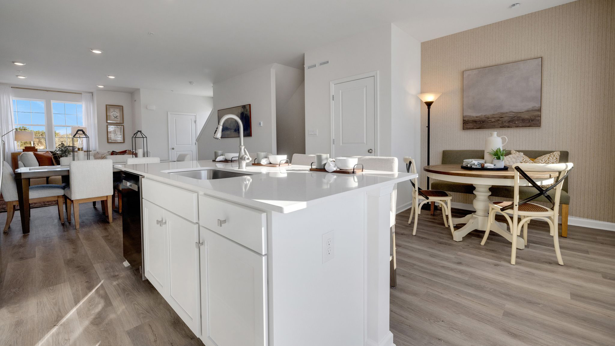 Bright kitchen that flows into the living room space.