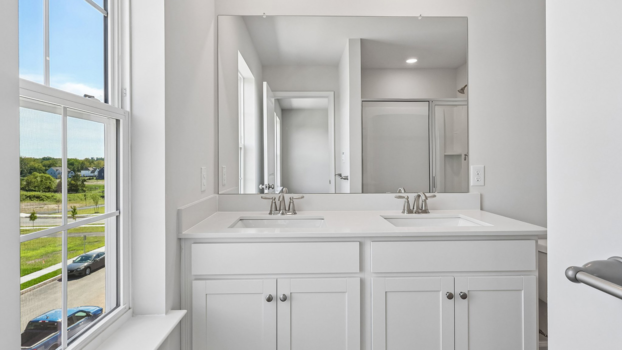 Primary bathroom with a double vanity.