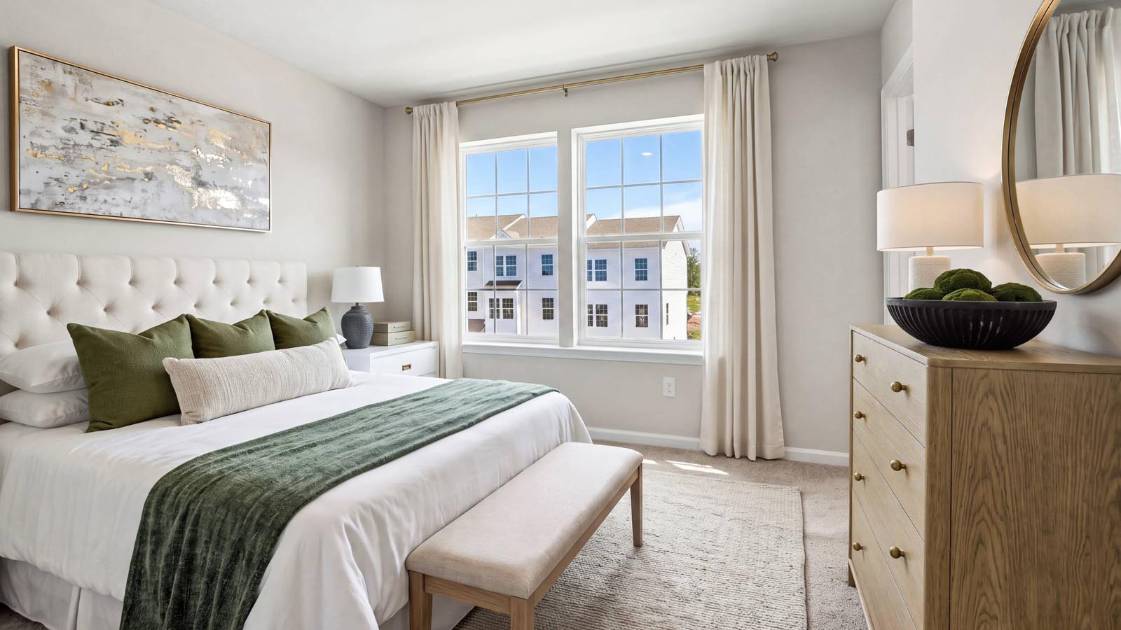 Primary bedroom with two windows.