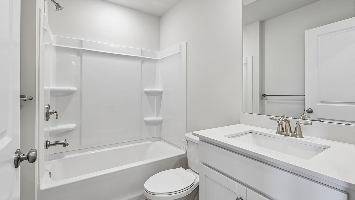 Second bathroom with tub shower.
