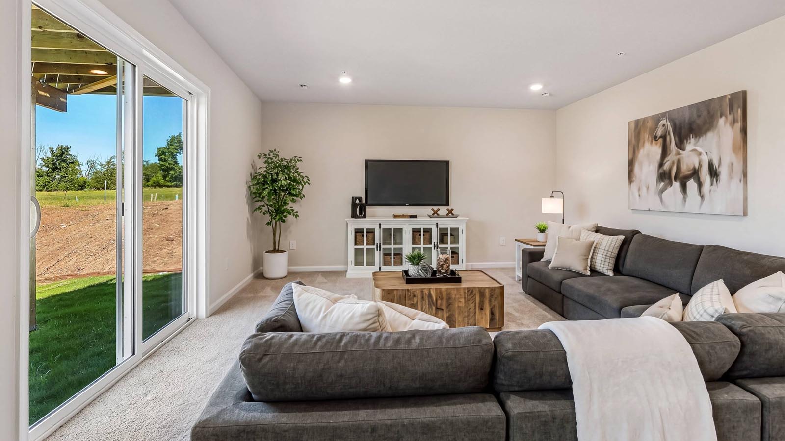 Finished recreation room is a versatile space for gathering and relaxing.