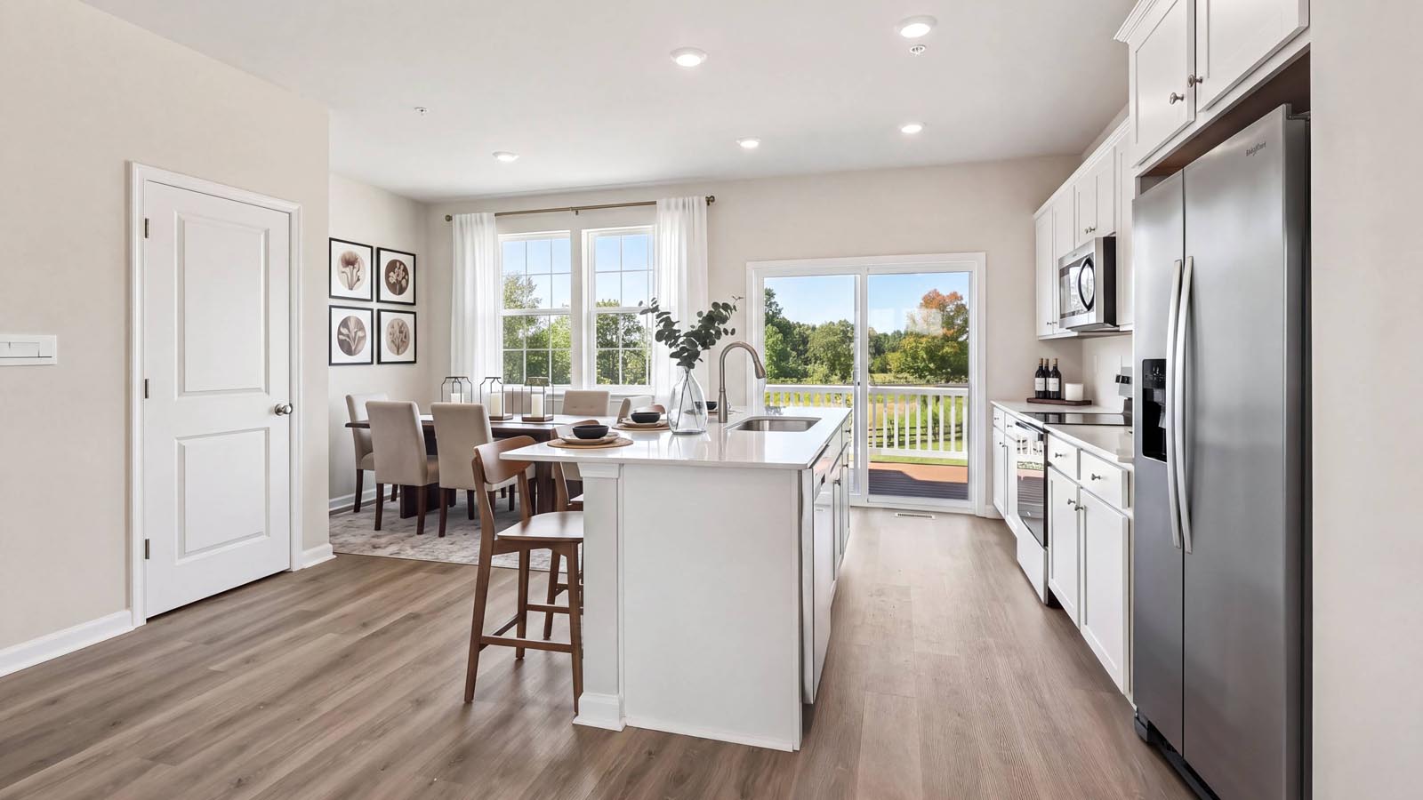 A view of the kitchen from the breakfast area with lots of natural light.