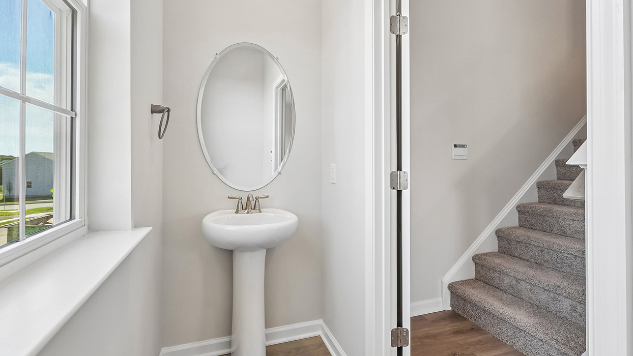 The powder room is located off the Living room area.