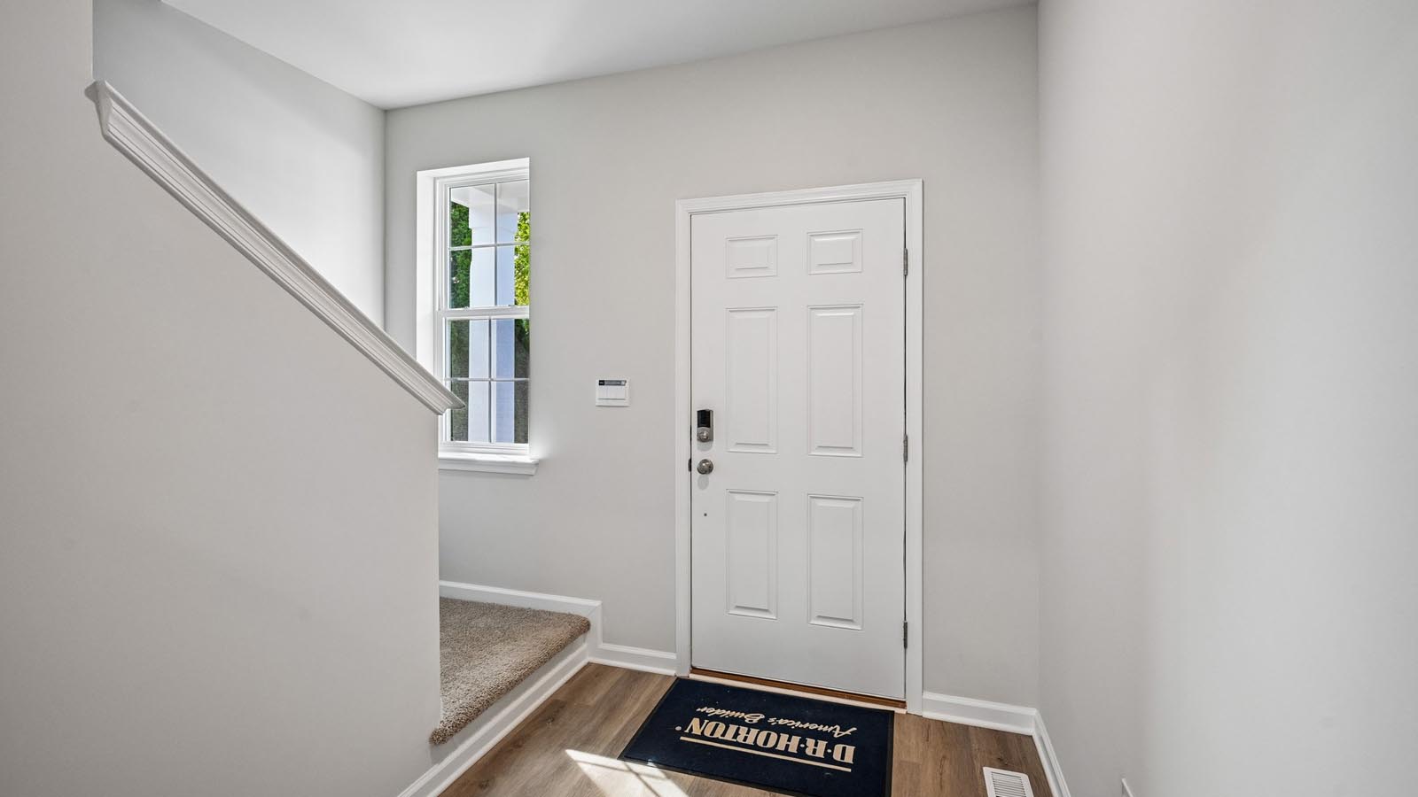 Foyer entrance with stairs to the left.