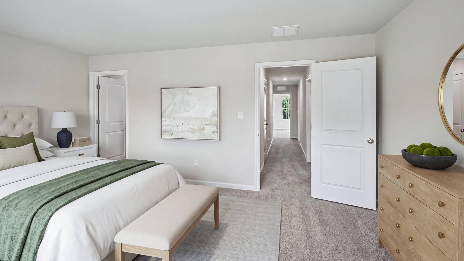 Primary bedroom with peek into the hall.