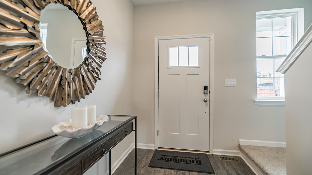 Foyer entrance with stairs to the right.