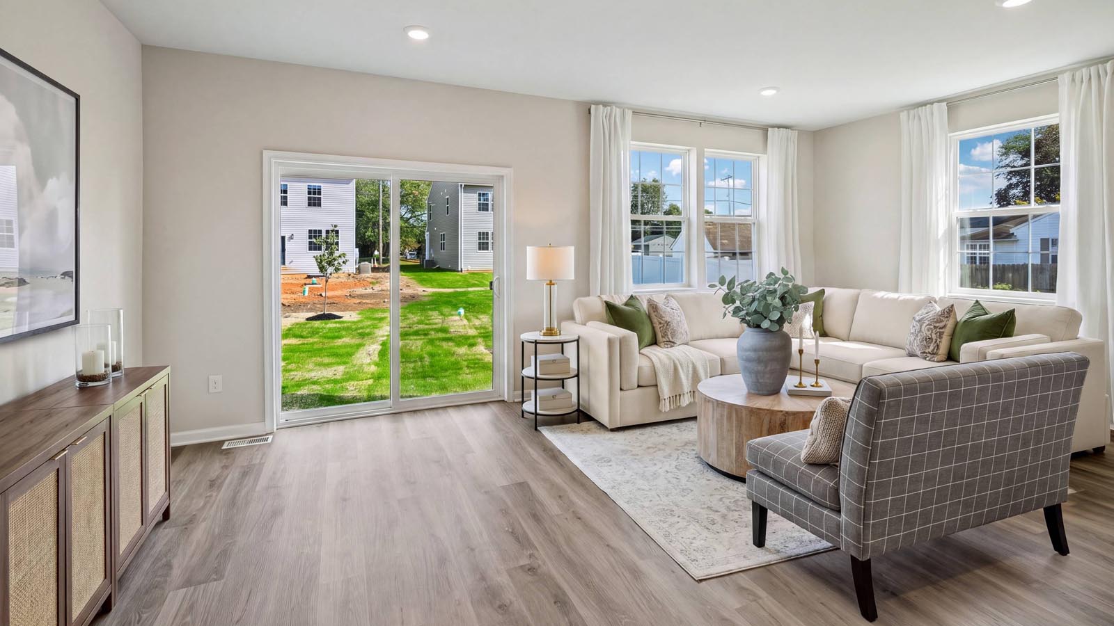 Spacious living area with several windows encasing the space.