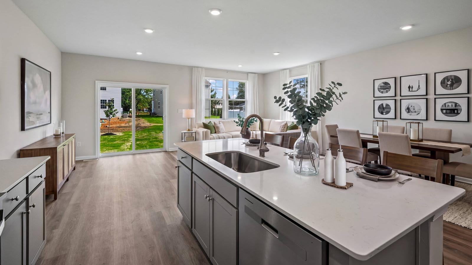Kitchen area with large island and view towards the open living area.