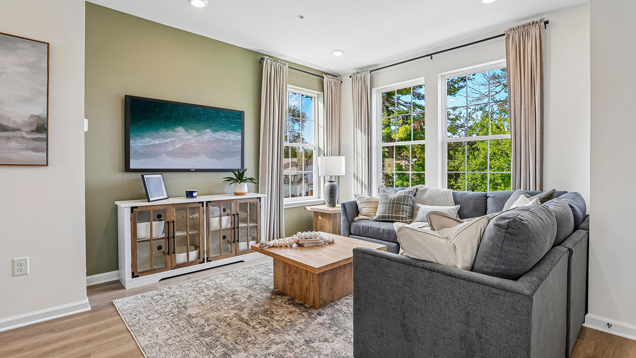 Living room area with three large windows