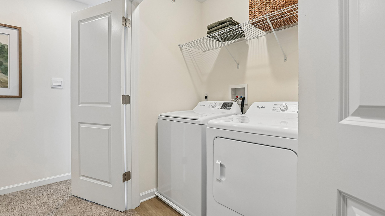 The laundry closet with washing machine and dryer