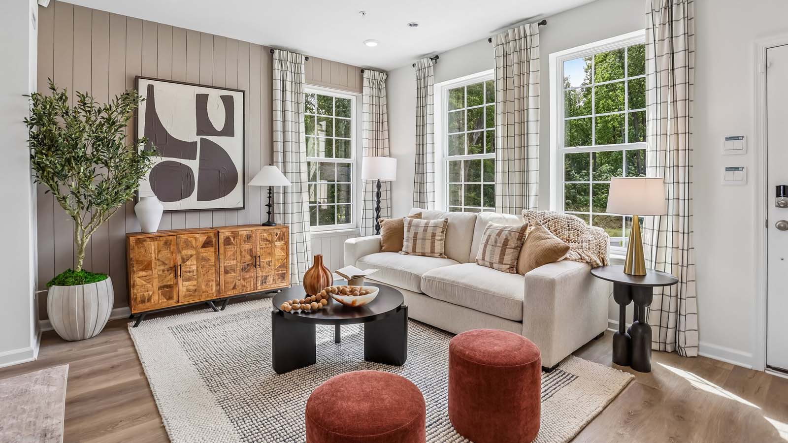 Living room area with three large windows