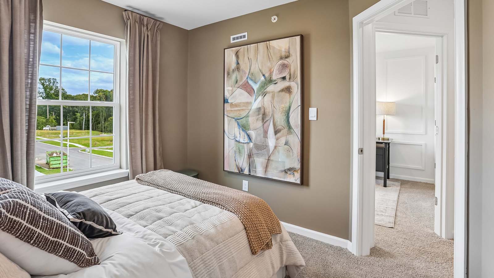 Bedroom two with a look into the hallway