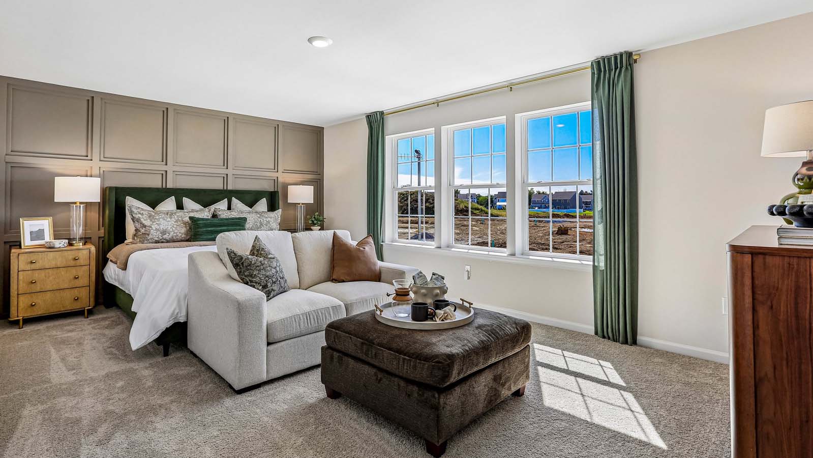 The impressive owner’s suite boasts an expansive bedroom and three large windows.
