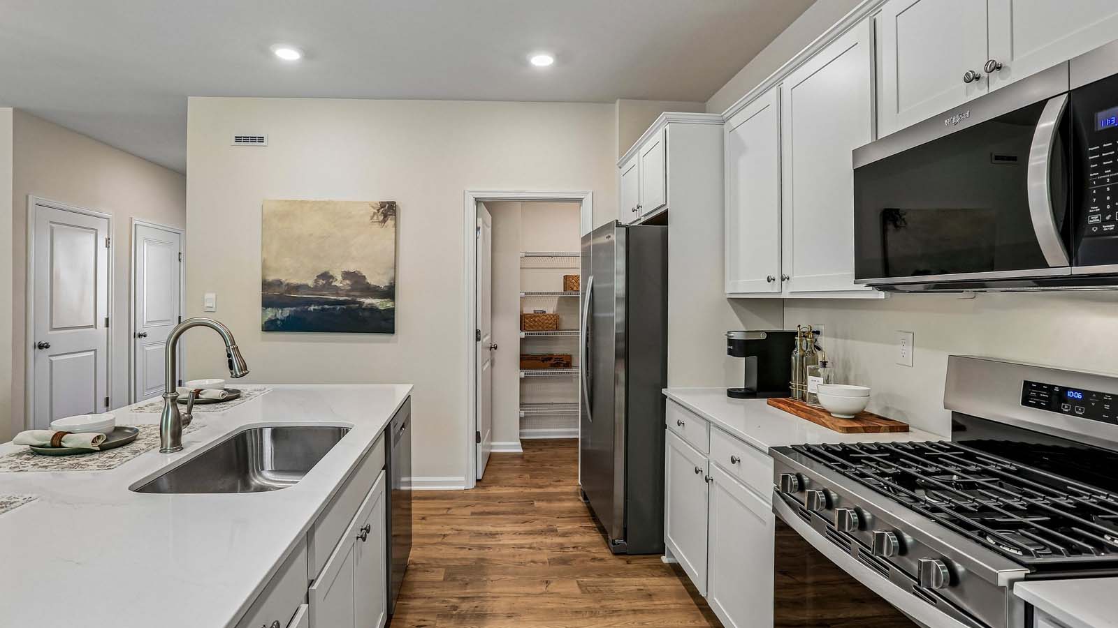The well-designed gourmet kitchen features a corner pantry.