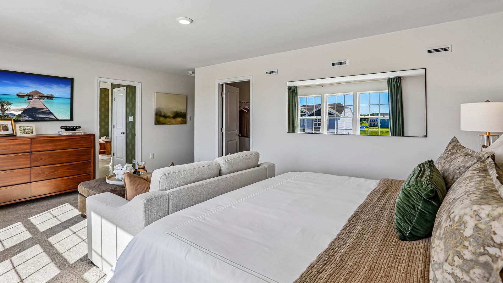 The owner's suite bedroom looking towards the private owners's suite bathroom.