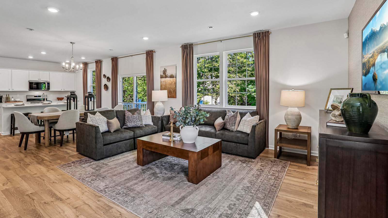 Open-concept living area with recessed lighting and seamless flow to main living spaces.