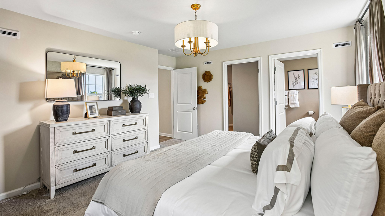 Primary bedroom with ample floor space, and private bath access