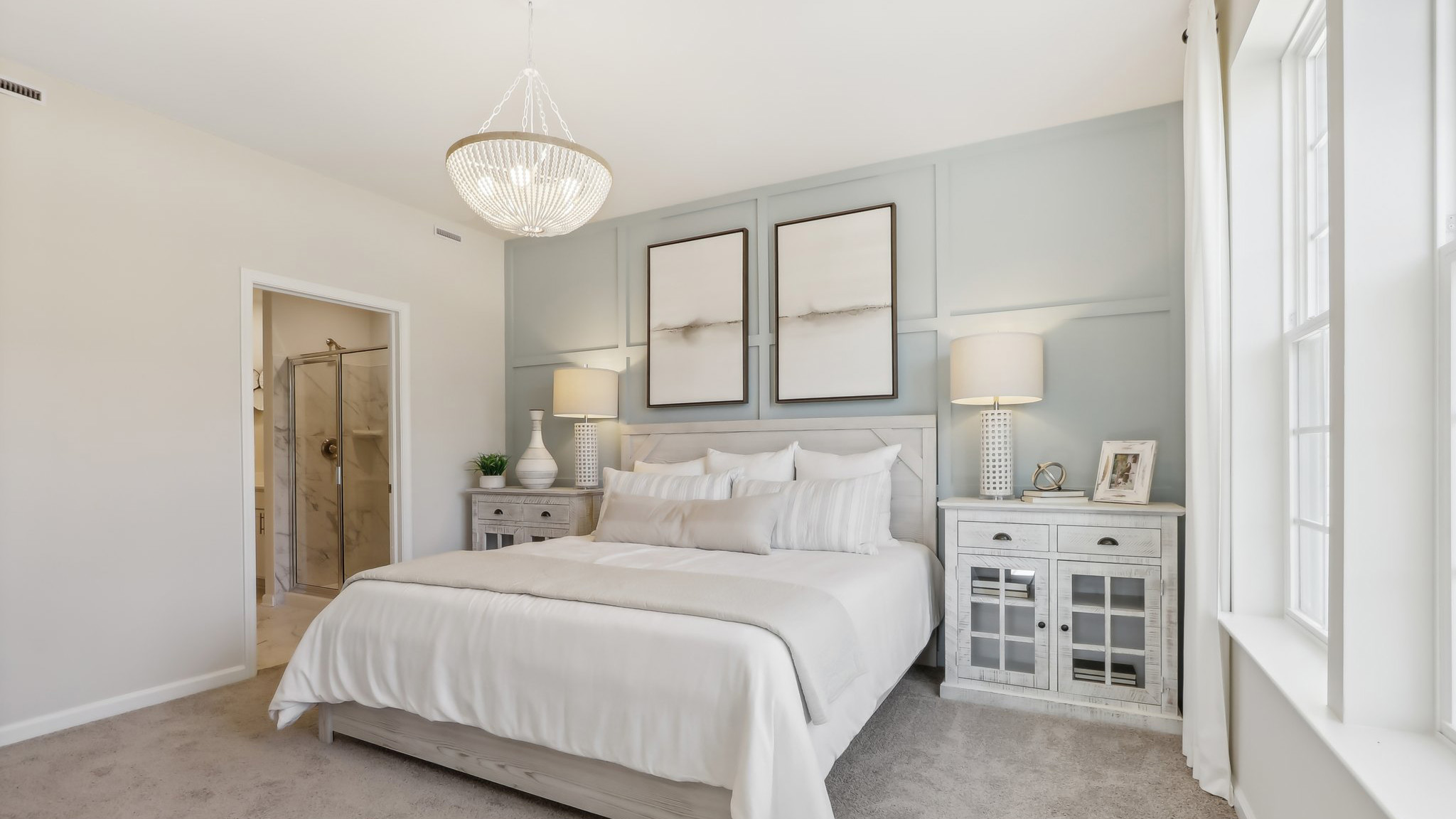 first floor main bedroom with beige carpet