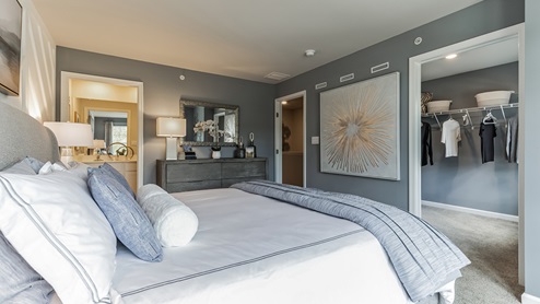 Primary bedroom with large closet and connecting bathroom.