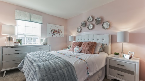 Third bedroom upstairs girly themed with large single window.