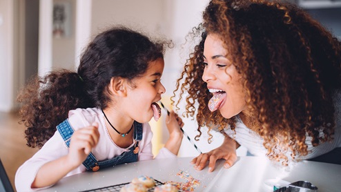 Mother and daughter baking together