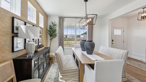 Formal dining room looking towards the front window and entrance.