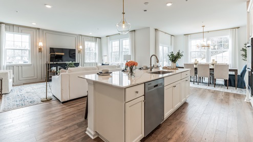 Kitchen area from the inside of the island and dining area in the back right corner.