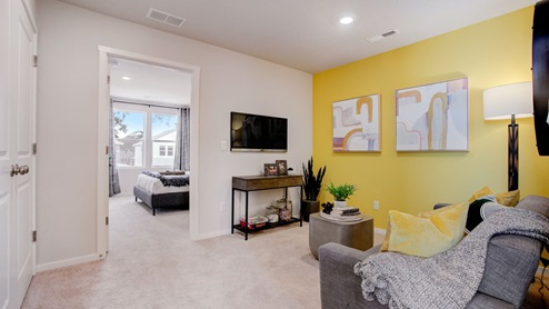 Loft area with wall-to-wall carpet